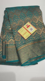 Load and play video in Gallery viewer, Classic Teal Blue Elegance Khaddi Banarasi Crepe Silk Saree SS26055
